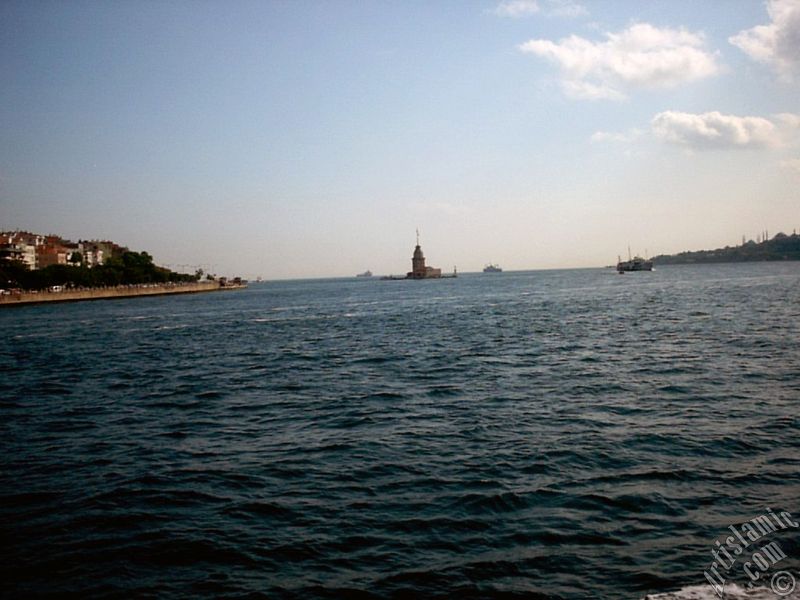 View of Uskudar coast, Kiz Kulesi (Maiden`s Tower) and Sarayburnu coast from the Bosphorus in Istanbul city of Turkey.
