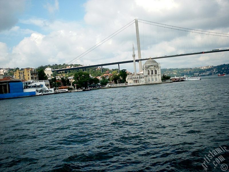 View of Ortakoy coast, Ortakoy Mosque and Bosphorus Bridge from the Bosphorus in Istanbul city of Turkey.
