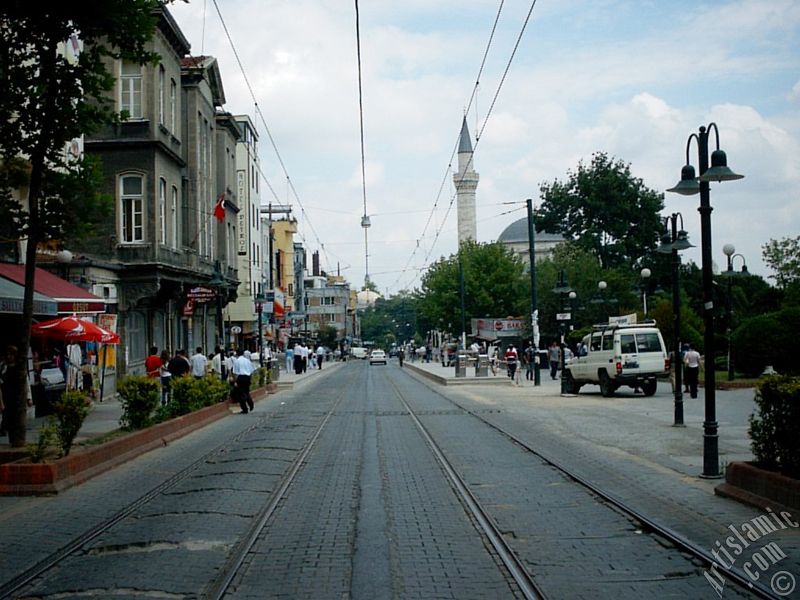 The way of tram and Firuz Aga Mosque in Sultanahmet district of Istanbul city in Turkey.
