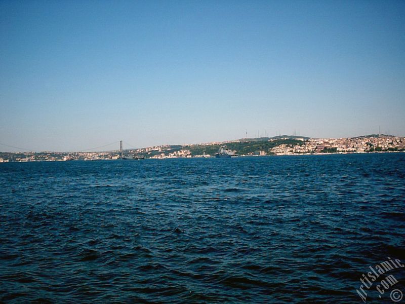 View towards Bosphorus Bridge and Uskudar coast from a park at Kabatas shore in Istanbul city of Turkey.
