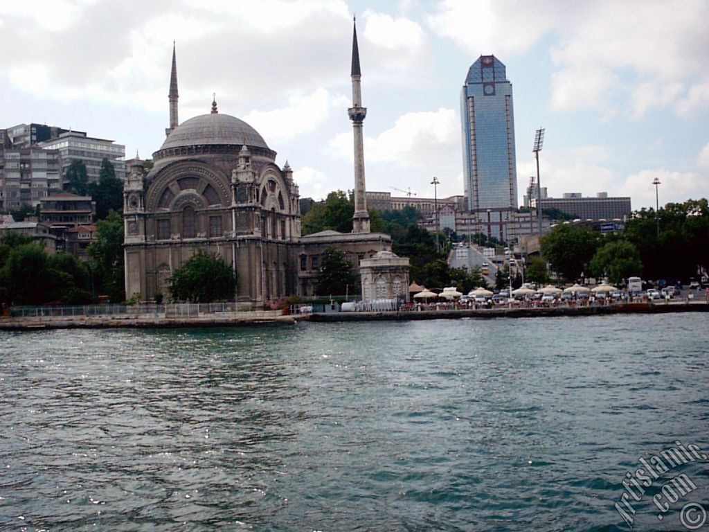 View of Dolmabahce coast and Valide Sultan Mosque from the Bosphorus in Istanbul city of Turkey.
