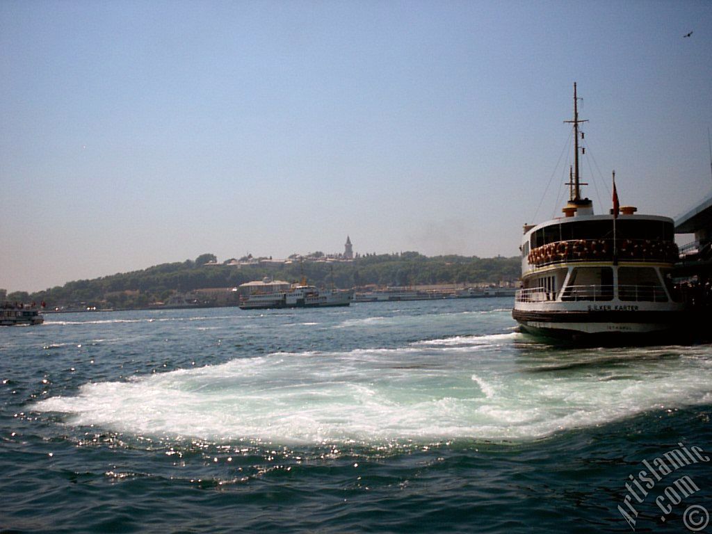 View of Eminonu coast, the ship and Topkapi Palace from the shore of Karakoy in Istanbul city of Turkey.
