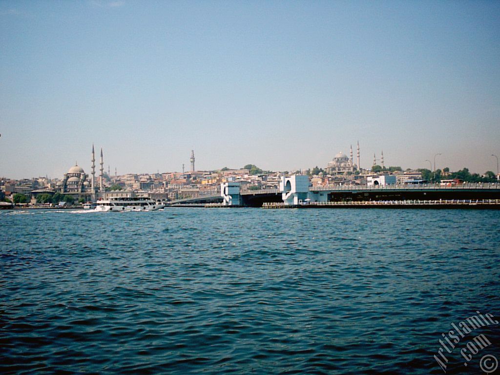 View of (from left) Yeni Cami (Mosque), (at far behind) Beyazit Mosque, Beyazit Tower, Galata Brigde and Suleymaniye Mosque from the shore of Karakoy in Istanbul city of Turkey.
